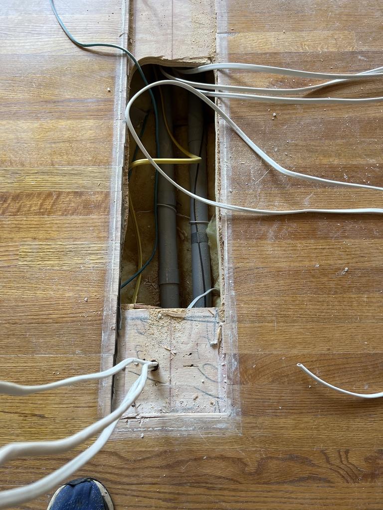 Wiring from the old wall that needs to be rerouted to accomodate an open concept kitchen.